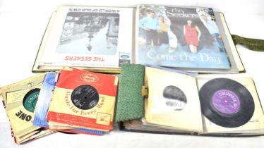 A group of vinyl records and 7" singles to include Elvis Presley "I Need Your Love Tonight", Emile