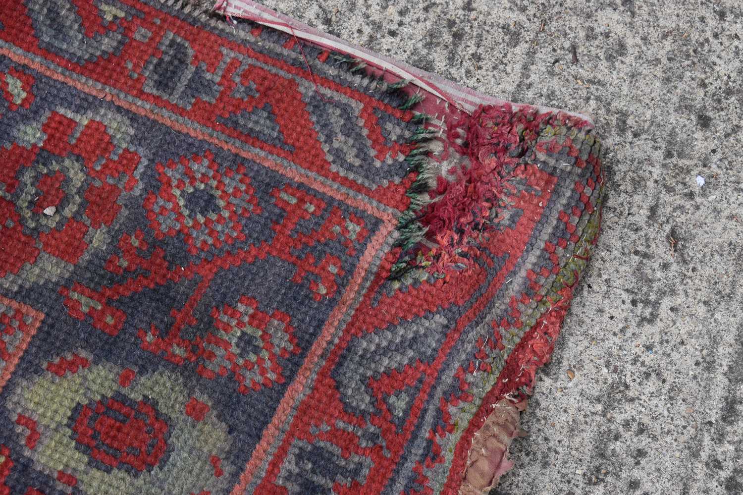 Two antique wool rugs likely Middle Eastern origin both with red ground and stylised motifs and - Bild 10 aus 13