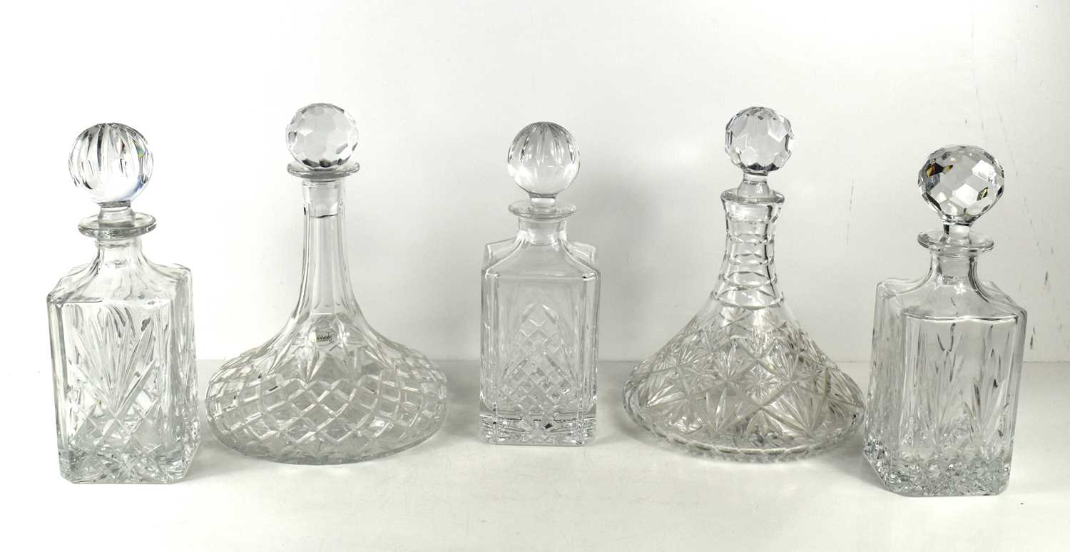 Two similar cut glass ships decanters, one with original Harrods labels still present, 26cm high,