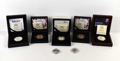 A collection of silver coins comprising of two silver proof £2 poppy coins, RAF centenary silver