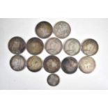 A collection of silver coins comprising of seven Queen Victoria crowns, an Edward VII crown, two