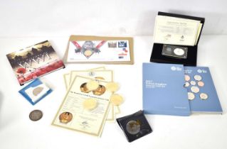A group of coins, some silver to include a 1935 crown, WWI centenary gold plated crown, a Royal Mint
