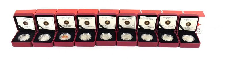 A group of nine Canadian Mint ten dollar silver coins, different designs to include Wolf, The