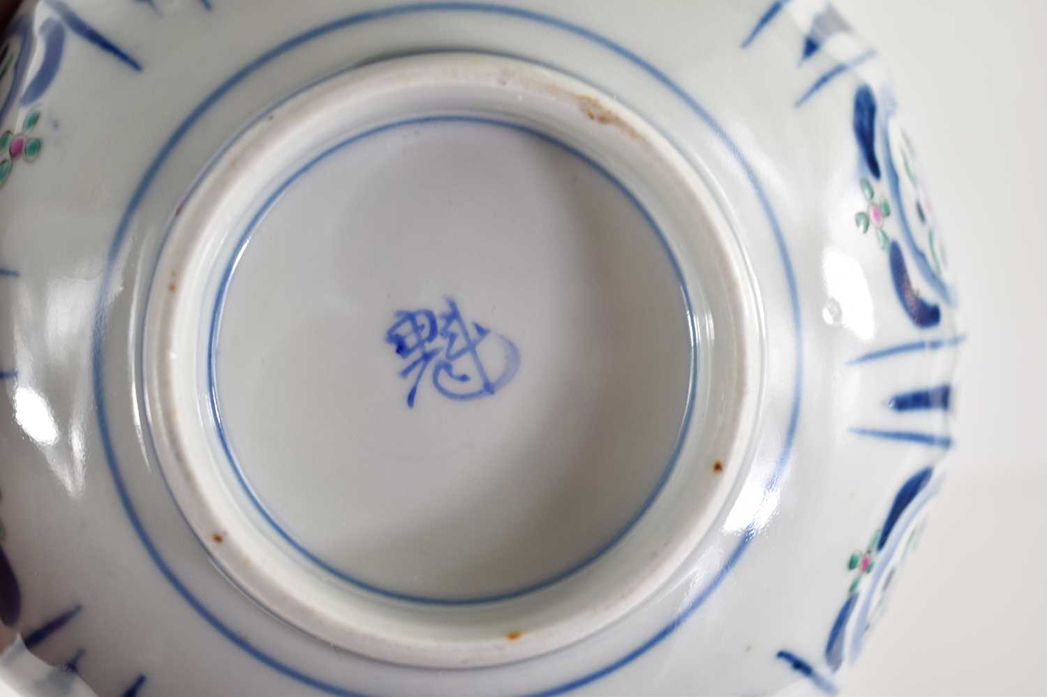 An Oriental bowl decorated with panels of flowers, cut rim with flower basket cartouche, 17.5cm wide - Image 3 of 4