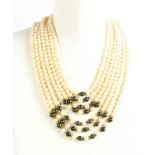 A cultured pearl multi strand necklace, the waterfall form necklace composed of seven strands of