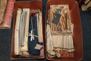 Two boxes of antique knitting needles some in fabric binded sets.