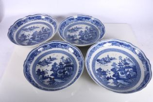 Four Chinese blue and white dishes decorated with pavilion and garden scenes, 25cm and 23cm