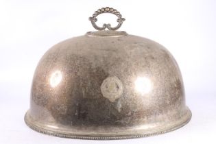 Large silver-plated cloche decorated with clan crest with lion and garter.