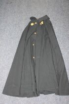 Dark green trench coat with label for Stewart & Sons of Edinburgh, named Dr G Dunlop Clerk with