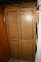 Antique scumbled wooden two door wardrobe, raised on plinth base, 215cm high.