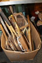 Box containing vintage tennis rackets.