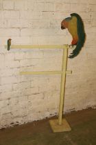 Vintage painted two bar towel rail with parakeet design, 137cm high.