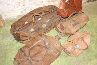 Large vintage leather holdall, a similar Gladstone type bag, and others.
