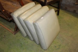 Four leather covered classic Land Rover seat pads.
