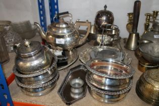 Silver-plated ware to include four wine slides, an egg epergne, two teapots, salvers, etc.