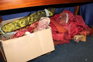 Quantity of curtains, fabrics and fabric cuttings in different materials.