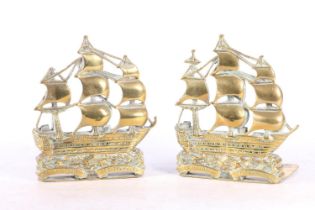 Pair of pierced brass bookends modelled as the ship HMS Victory, 15cm tall.