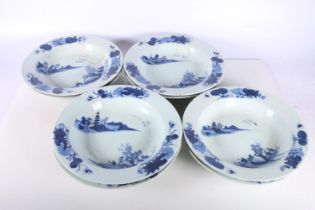 Eight Chinese blue and white tin glazed dishes decorated with pavilion scene, 23cm diameter.  (a/f)