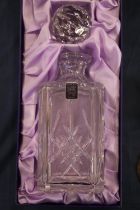Edinburgh Crystal cut-glass decanter of square section, in original box with stopper.
