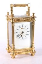 French gilded brass carriage clock, the white enamel dial with Roman numerals, 16cm tall.