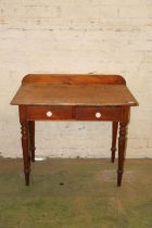 Early 20th century pine side table with two frieze drawers, raised on turned supports, 91cm wide.