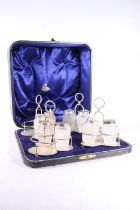 Cased set of four Victorian silver mounted hobnail cut glass cruet stands, by Walter & John Barnard,