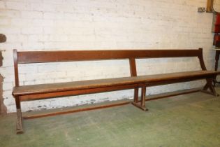 Antique mahogany bench with X-form trestle end, 295cm long.