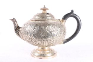 Georgian silver bullet shaped teapot with all over floral decoration by Edward Thomason,