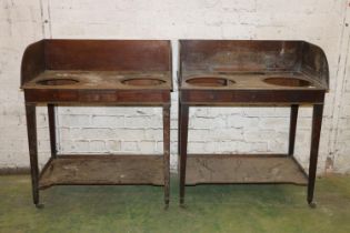 Pair of 19th century mahogany washstands, raised on square tapering supports, capped by brass