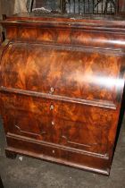 Antique flame mahogany veneered cylinder bureau with fully fitted interior including drawers,
