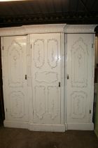 Antique French style three door break front wardrobe, the ornate cornice with acanthus leaf and