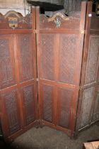 Early 20th century carved oak three panel folding dressing screen, with carved pressed Amat Victoria
