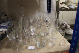 Glassware to include drinking glasses, a mallet shaped decanter, etc.