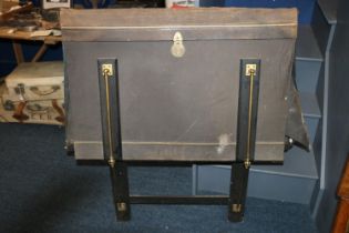Antique French empire style fire screen raised on trestle ends capped by castors, 123cm tall.