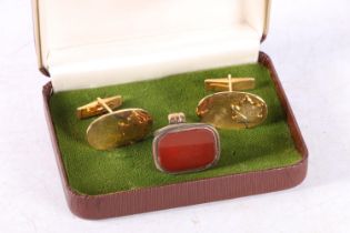 Yellow metal seal fob inset with uncarved carnelian and a pair of Canadain cufflinks.