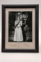 Framed photograph of Prince Philip and Queen Elizabeth II, signed and dated 1992 to the mount, in