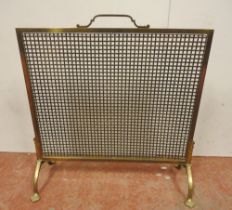 Arts & Crafts brass fire screen with mesh protection screen, on splayed supports and stylised