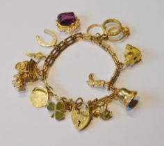 9ct gold charm bracelet with various gold and other charms dependant, 32.5g gross.