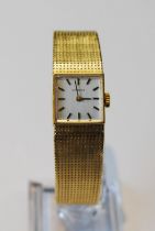 Lady's Tissot 18ct gold watch with square dial, on integral Milanese bracelet, 41g including movem