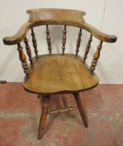 Victorian ash and elm bow-back smoker's or captain's chair, with turned spindle columns and solid