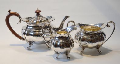 Silver three-piece tea set of waved globular form, initialled, Birmingham 1931, 1,272g.