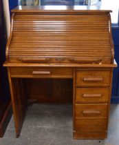 Oak roll-top desk, c. 1930s, with tambour roller shutter enclosing drawers and pigeonholes, above