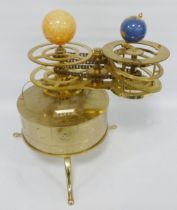 Replica brass and gilt revolving three planet orrery with chain-driven mechanism, on a cylinder base