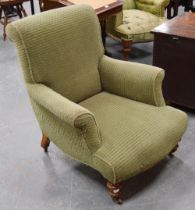 Victorian walnut armchair upholstered in later green fabric, on turned supports and castors