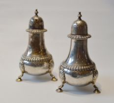 Pair of silver baluster pepperettes of Georgian style, by The Goldsmiths & Silversmiths Co., 1926,