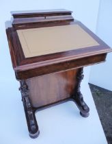 Victorian mahogany davenport, the hinged desk stand above a flap enclosing bird's eye maple-lined