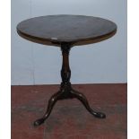 George III mahogany tea table, the saucer top on turned birdcage plinth above a turned column,