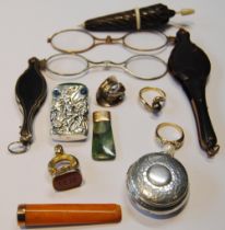 Two lorgnettes, a gold-mounted amber cigarette holder, 1926, silver vesta, seal fob, greenstone
