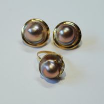 Pair of mabe pearl ear clips and a similar ring with tiny diamonds, '14k'.