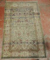 Persian hand-knotted rug with multiple trailing foliate patterns and guard stripes, on cream